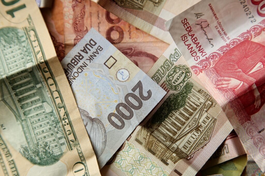 high angle closeup shot pile banknotes wooden surface